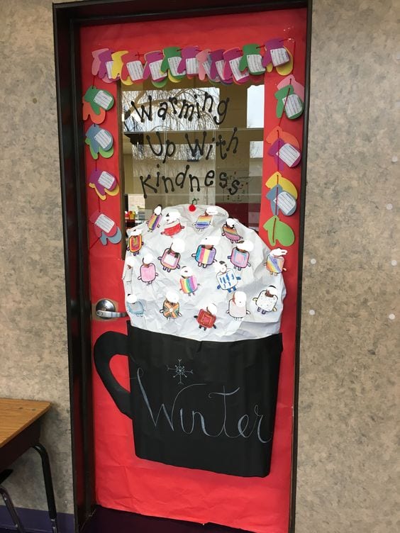 Holiday classroom doors are decorated with a large mug of hot chocolate and mittens 