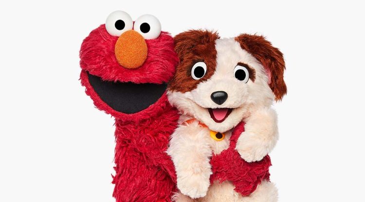 Sesame Street characters Elmo and pet puppy Tango