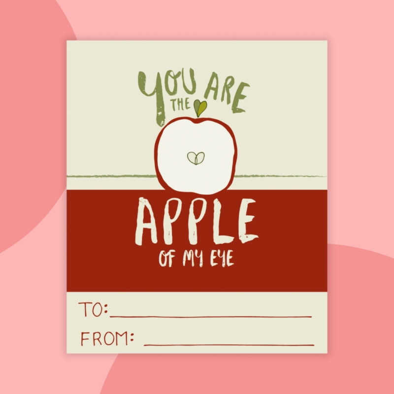 Printable Valentines a printable valentine that says: you are the apple of my eye with a red and tan background and a red apple cut in half