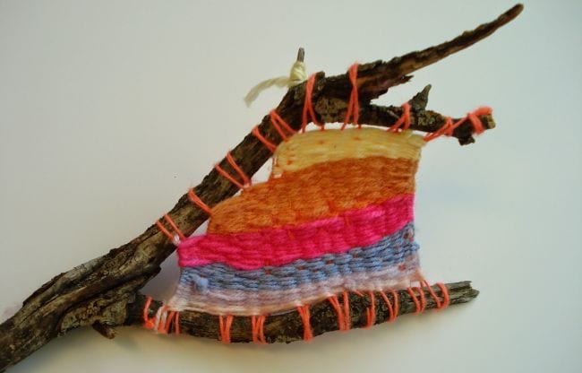 Stick sculpture with yarn