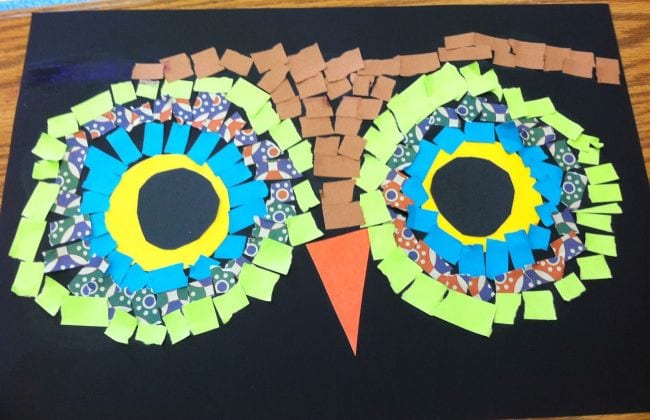 Owl eyes made with bits of colored paper