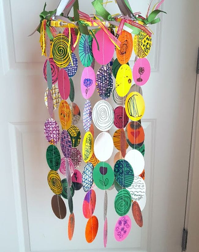 Mobile made of a variety of paper circles in different colors and patterns (First Grade Art Project)