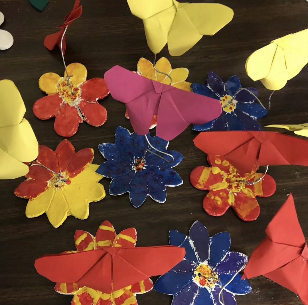 Origami butterflies on clay stands
