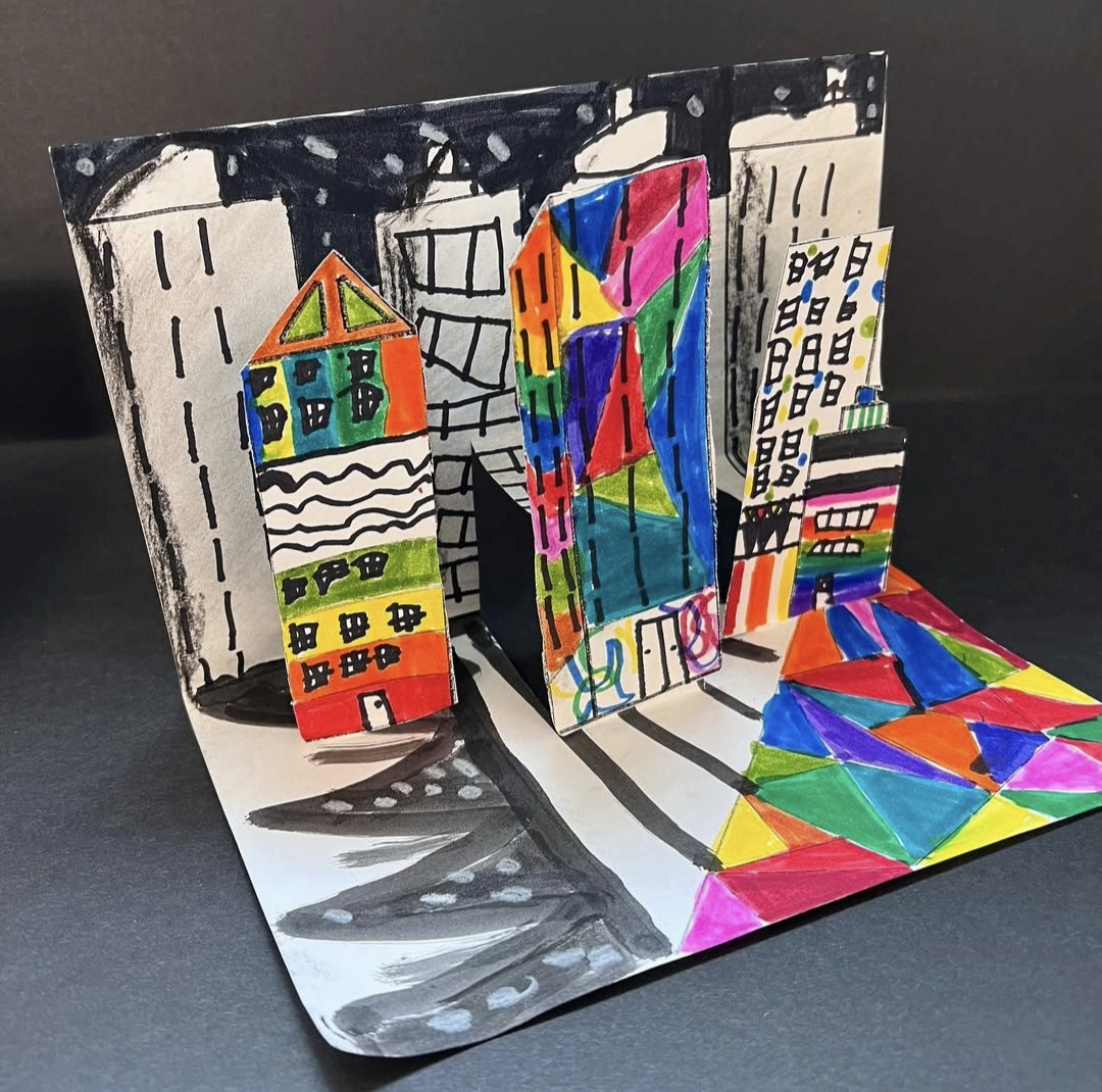 3D paper cityscapes made by 1st grade art students