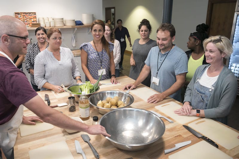 Adults in a cooking class - Free Teacher Trip