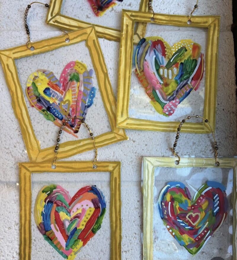 Colorful hearts on transparency sheets with gold frames