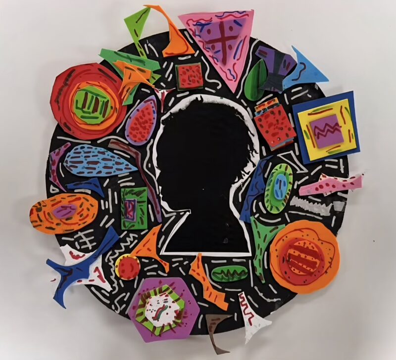 Colorful paper collage centered by a silhouette of a child's head
