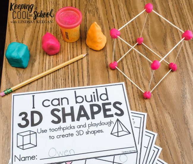 3D cube made from toothpicks and playdough, with cards that read I Can Build 3D Shapes