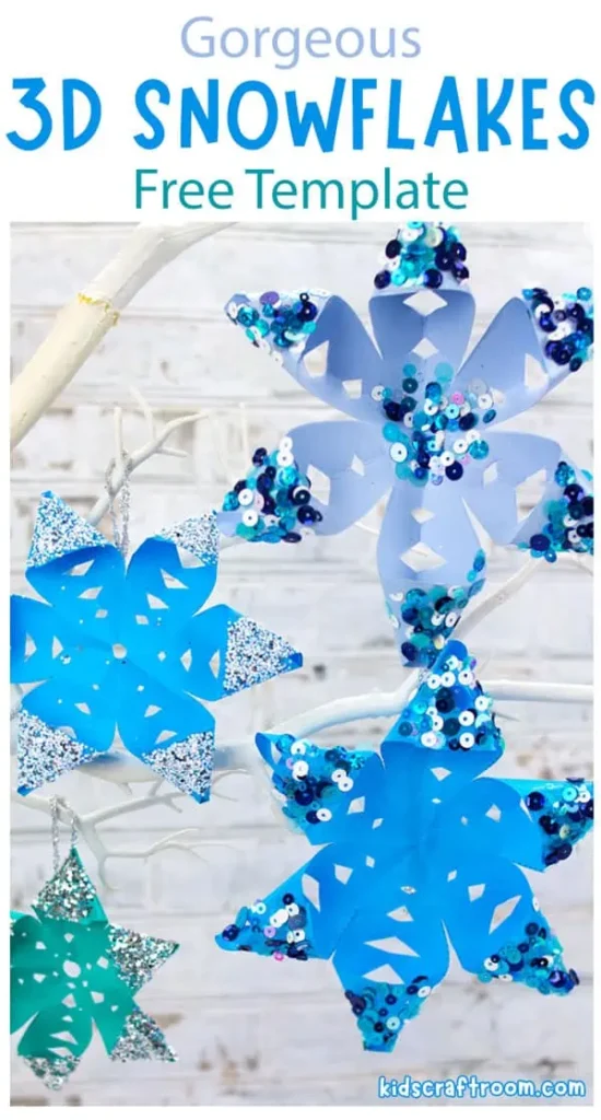 Several 3D snowflakes are shown made of blue and gray paper and sparkles and sequins. 