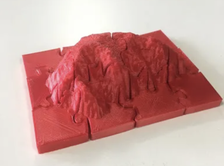 3d printed mountain range on red plastic