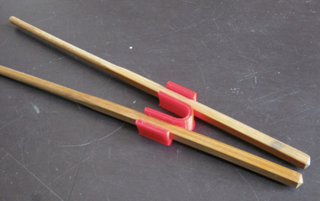 3d printed red chopstick trainer- 3D printing ideas