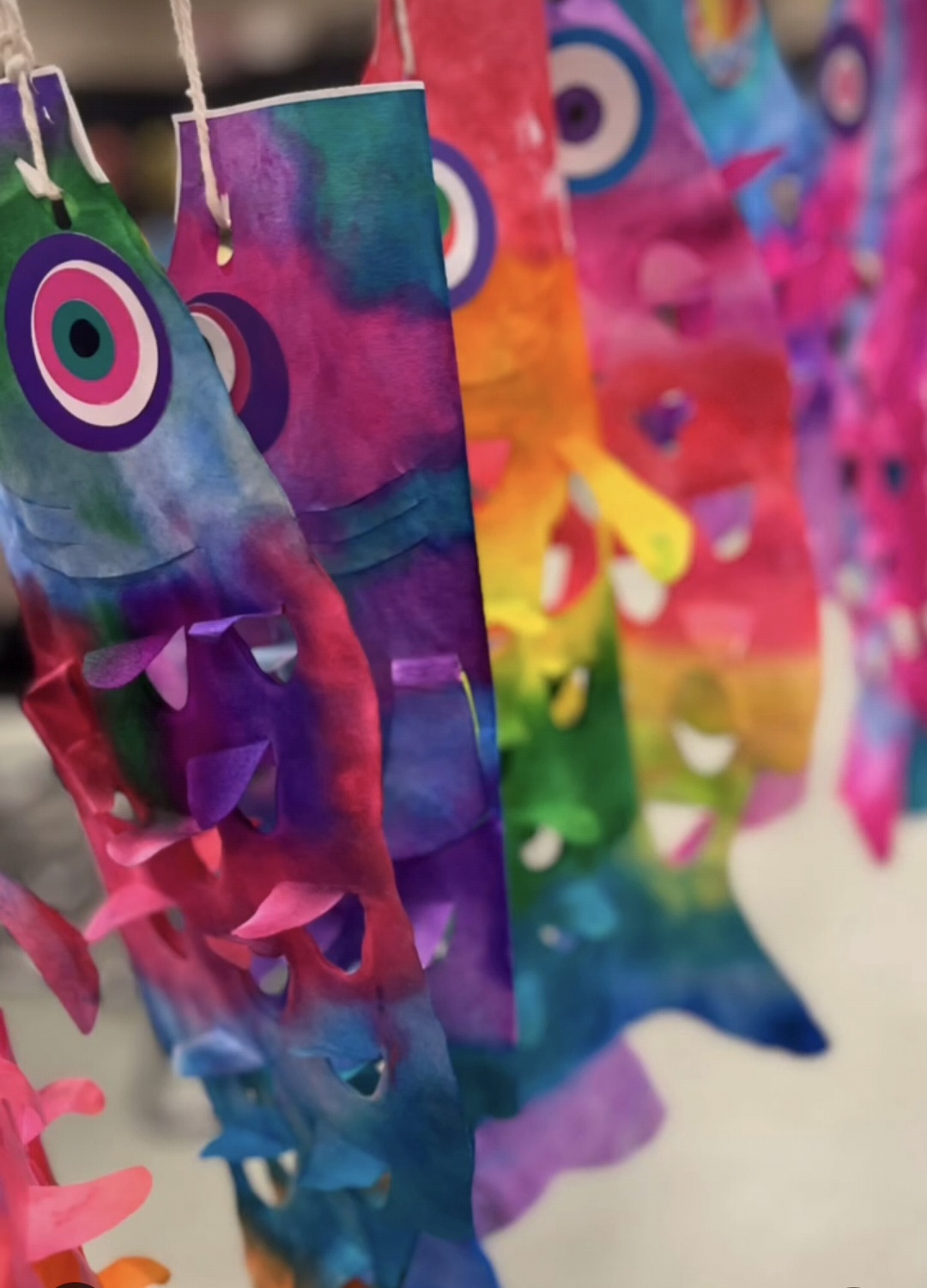 Colorful fish kites made in 3rd grade art class