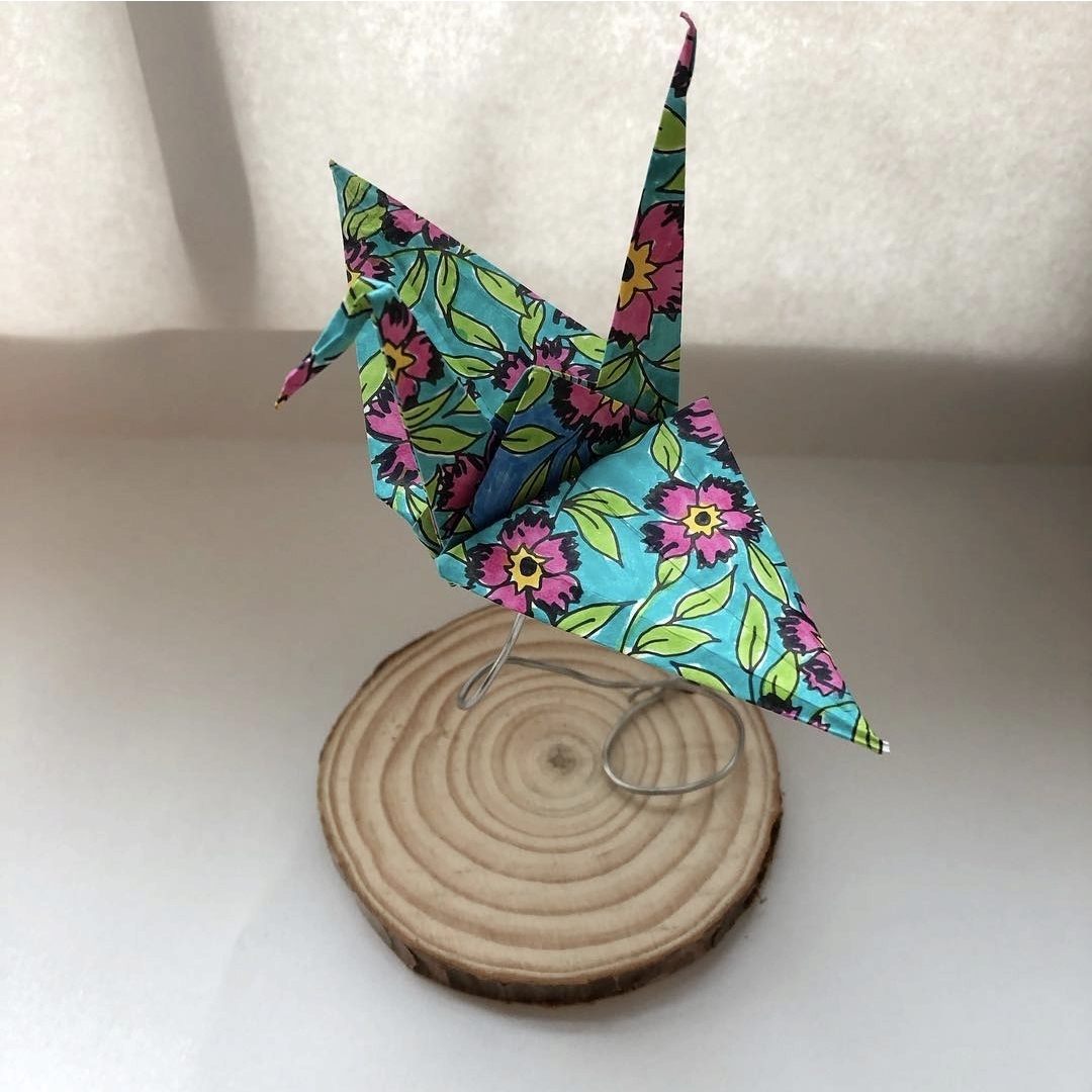 Origami cranes made from patterned paper designed and drawn by third grade art students