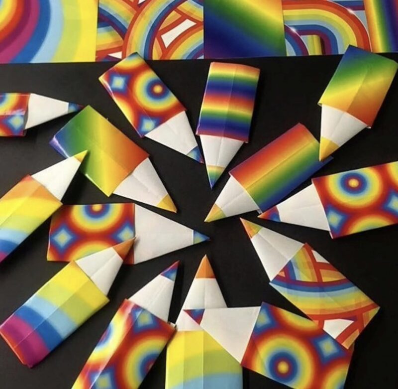 Origami pencils made from bright neon striped paper