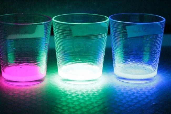 Three clear glasses filled glowing liquids (Fifth Grade Science)