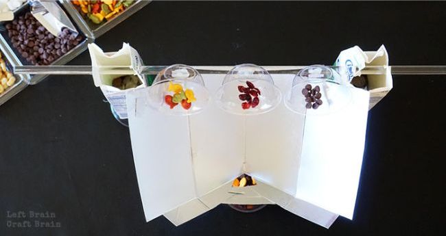 Candy dispensing machine made from recycled materials
