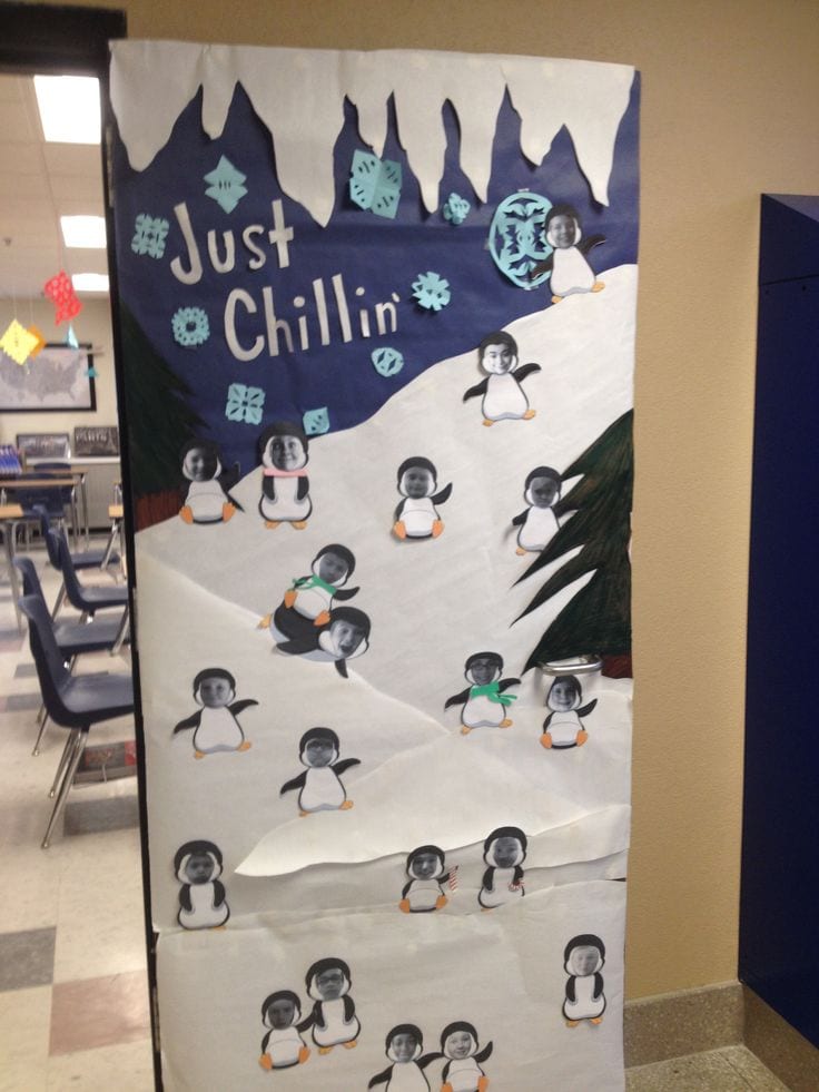 Holiday classroom doors include this one decorated to look like a snowy slope, with penguins with pictures of students' faces 