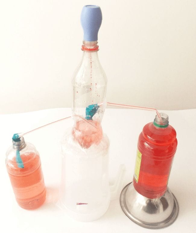 Simple heart pump model made from plastic bottles, drinking straws, and modeling clay