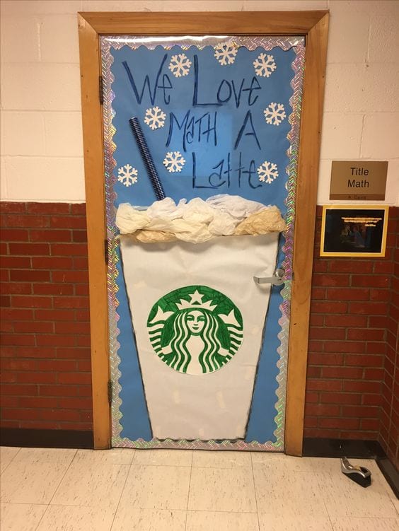 Classroom door decorated with a Starbucks cup, with text reading "We Love Math a Latte"