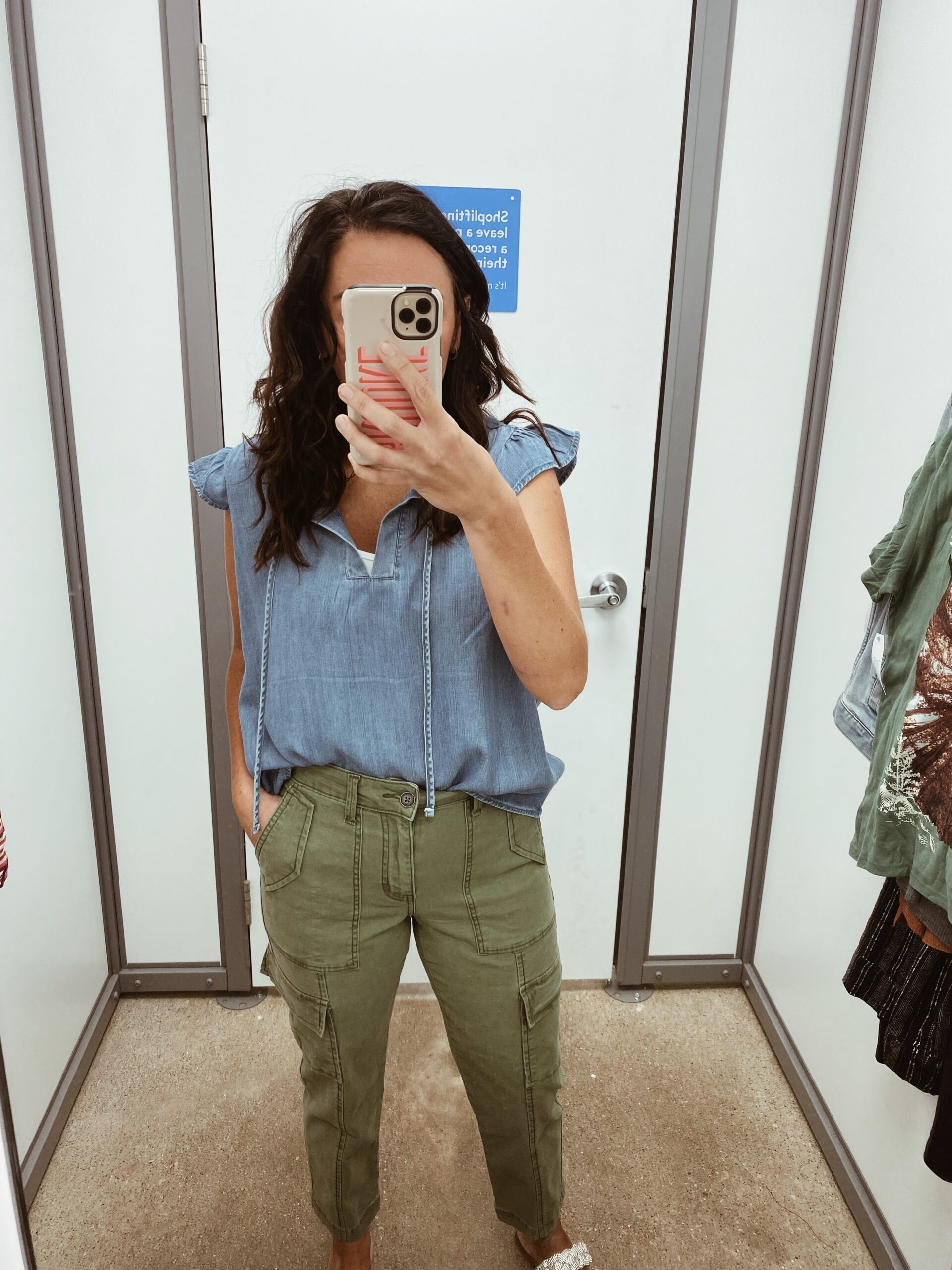 Woman wearing cargo pants and denim shirt as an example of cute teacher outfits