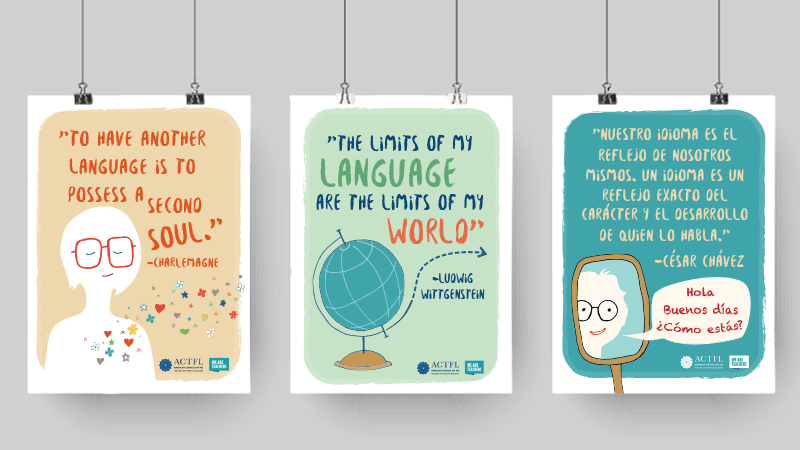 Three Free World Language Posters hanging from paperclips