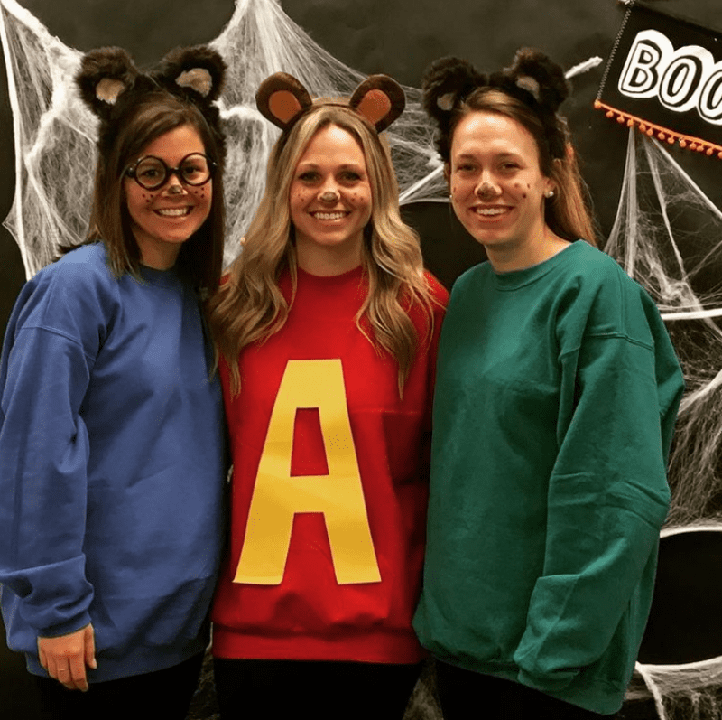 teacher halloween costumes shows three women dressed as the chipmunks alive, simon, and theodore.