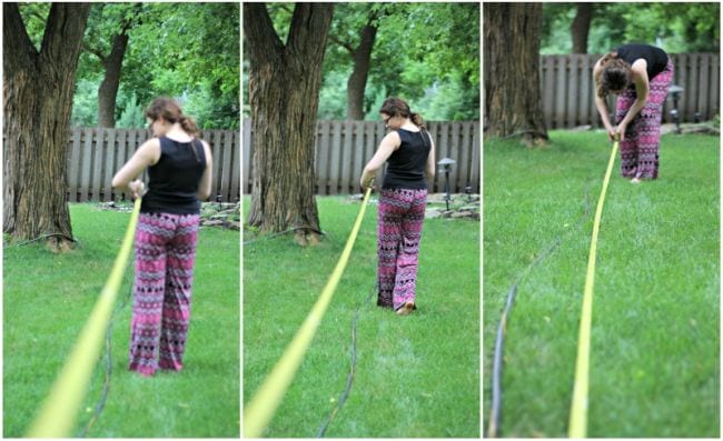 Girl pulling out hose on the grass so it lays flat- anatomy activities