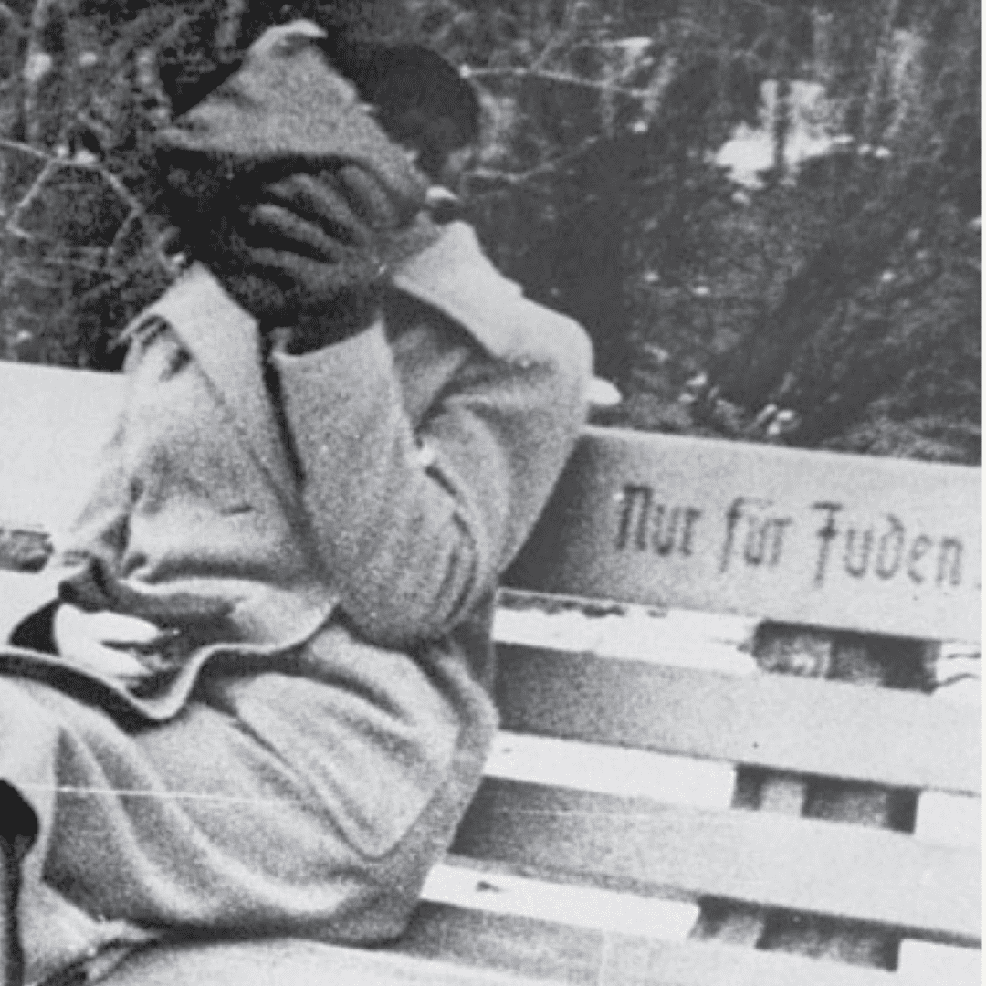 Black and white photograph of a woman sitting on a bench with the words 