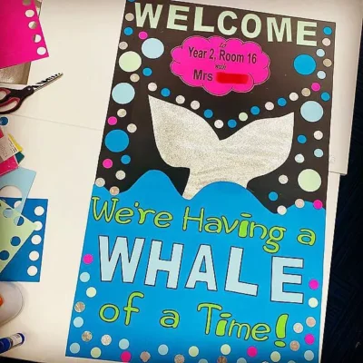 welcome, we're having a whale of a time. classroom door decoration whale ocean theme