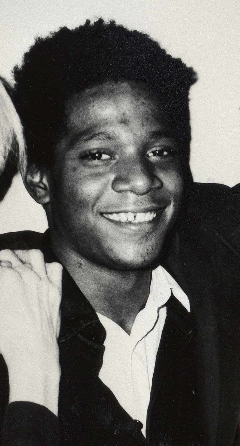 B&W photo of Basquiat smiling