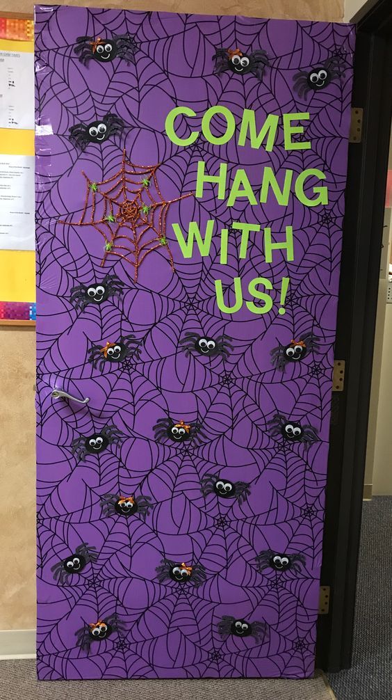 October bulletin board ideas can include doors like this one with a purple background and bats hanging off of it. Text reads, "Hang with us!"