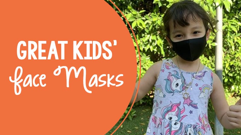 A young girl wearing a black face mask. There is orange text on the picture that reads Great kids face masks.