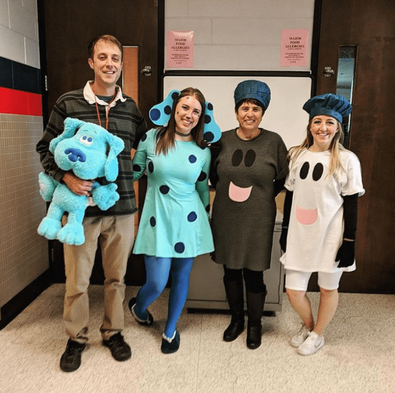 Four people are dressed as various characters from the show Blues Clues.