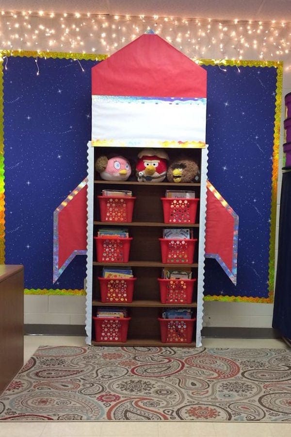 Red and white rocket ship classroom shelving organizer with baskets