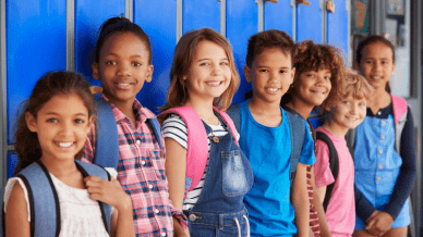 Elementary students standing in front of lockers - - Alternative to Suspension