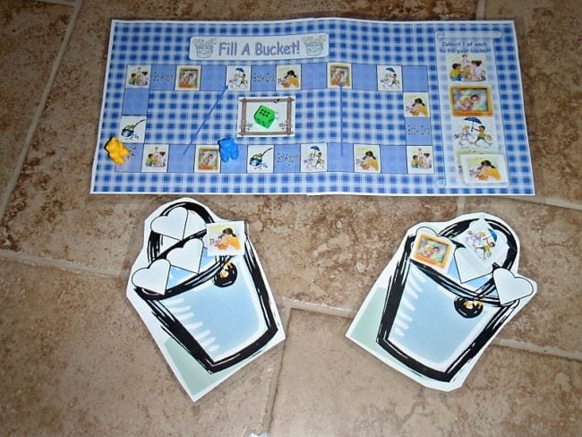 Bucket filler board game with large paper buckets