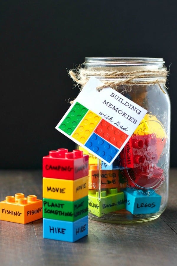 LEGO bricks in a jar with memories written on them.