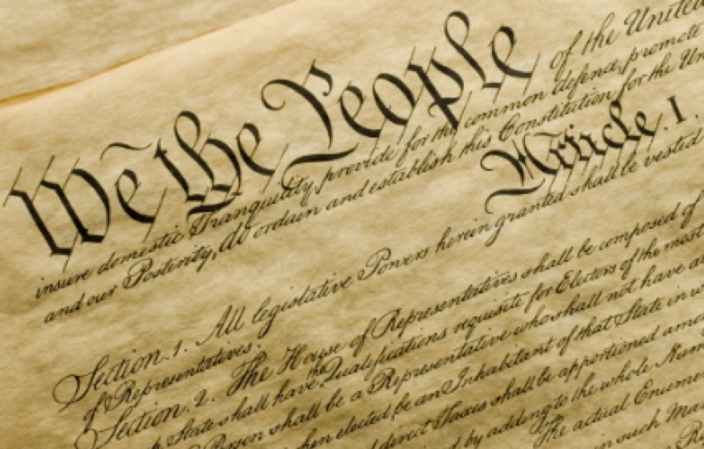 Paper saying "we the people..."