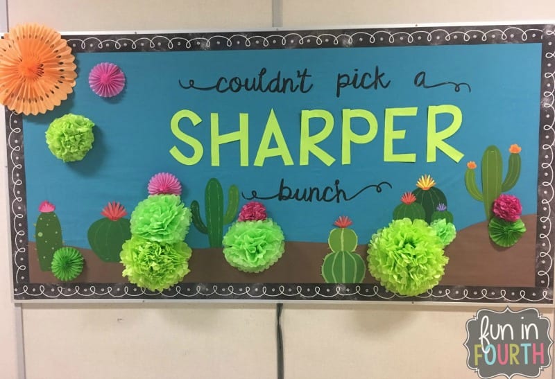 Bulletin board showing cactus made from tissue paper and paper cutouts. Text reads "couldn't pick a sharper bunch."