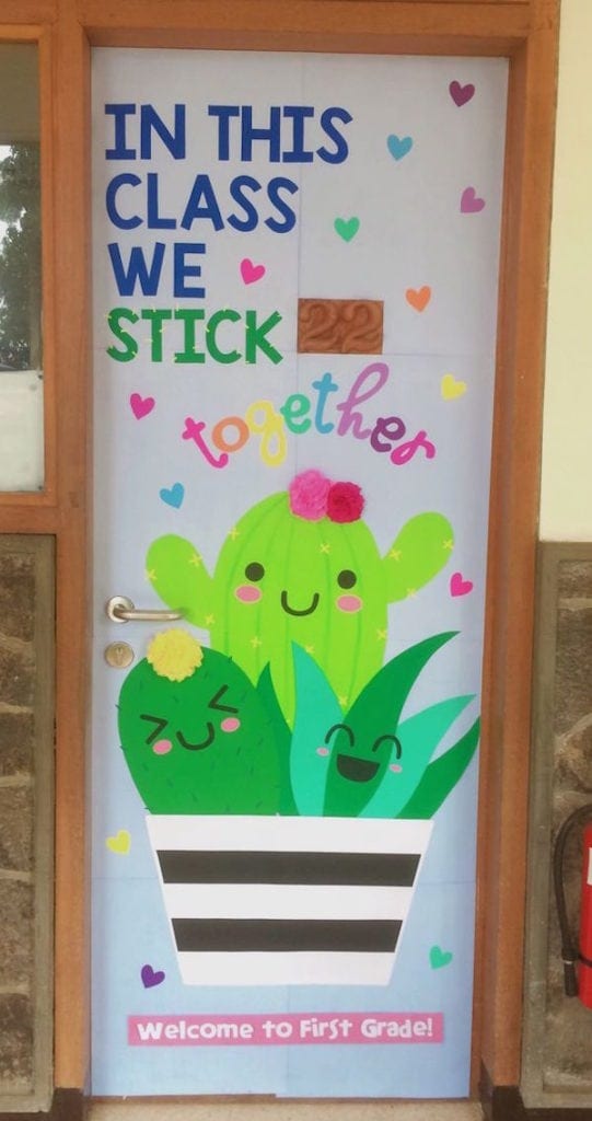 Classroom door display featuring three green cactus plants in a pot