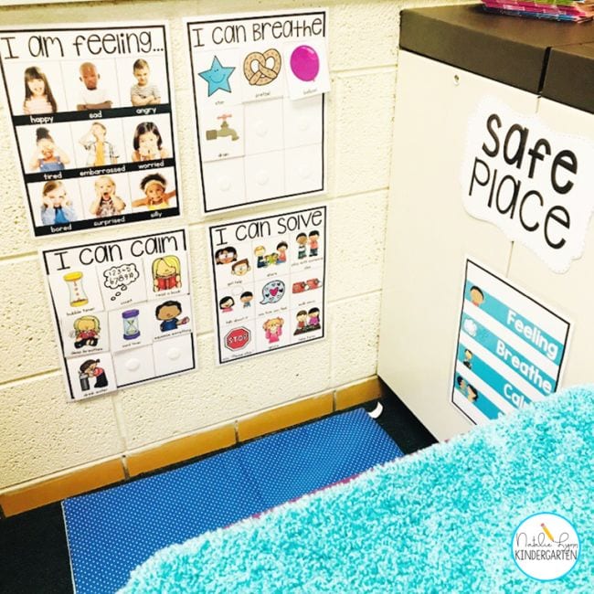 A calm down corner in a classroom with posters to help kids regulate emotions