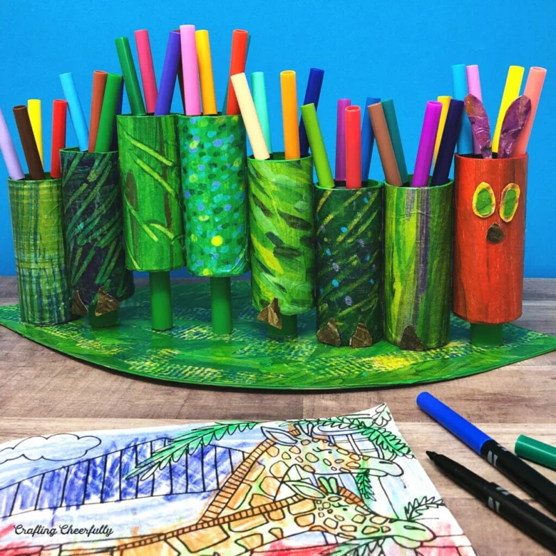 8 tubes are painted to look like the caterpillar in the story Very Hungry Caterpillar. Markers are inside of them.