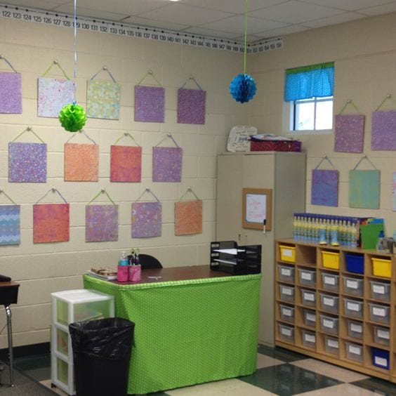 dresser knobs with hanging cork board squares on classroom wall. 