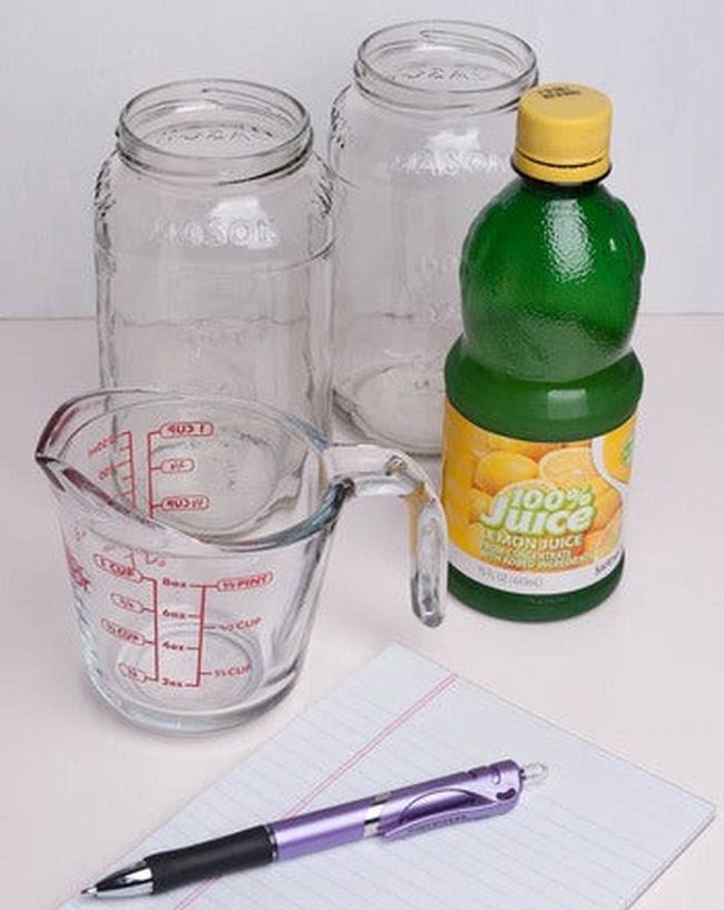 Glass measuring cup, glass jars, and bottle of lemon juice (Climate Change Activities)