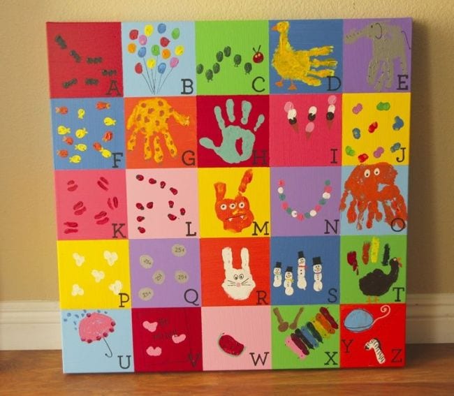 Collaborative art projects can include canvases like this one divided into squares with image representing a letter of the alphabet made with handprints or fingerprints in each 