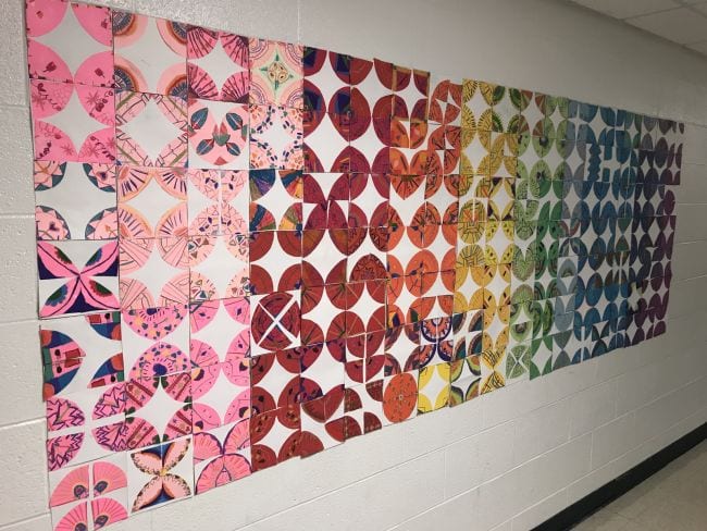 Paper quilt squares made of quartered circles in different colors