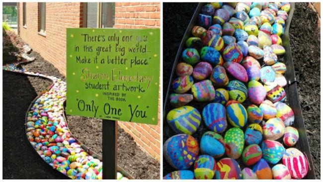 Painted rocks arranged to form a flowing river shape with a sign saying There's Only One You 