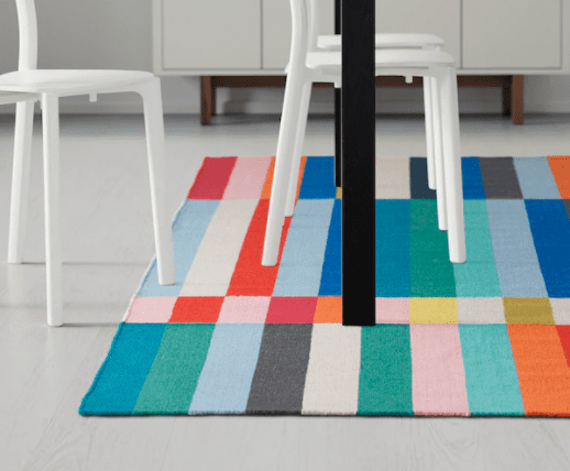Colorful rug with square and rectangle colored tiles