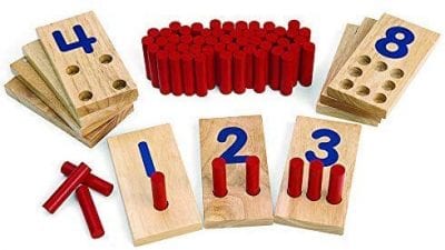 Wooden boards with different holes to represent numbers.