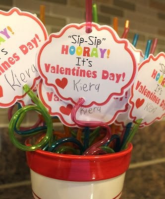 cup of colorful silly straws with valentine cards that say, "Sip-Sip Hooray! It's Valentine's Day"